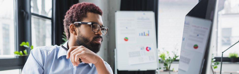African American Businessman Eyeglasses Looking Computer Monitor Office Banner