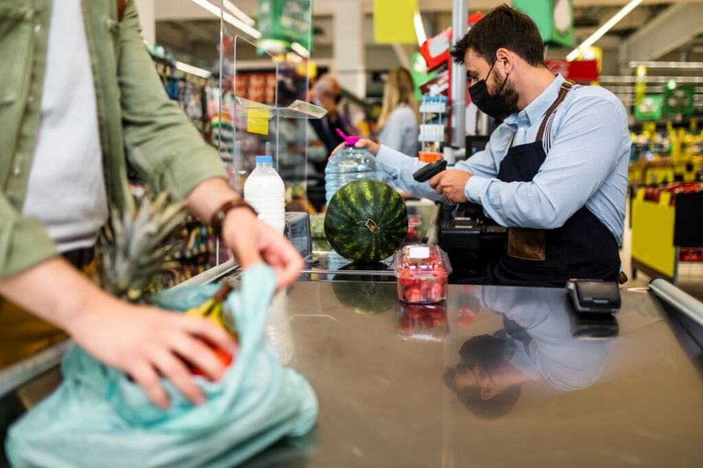 a man wearing a face mask at a grocery store