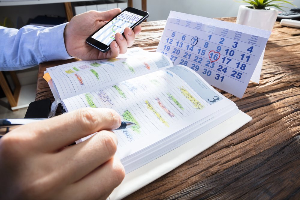 A businessman holding a mobile phone