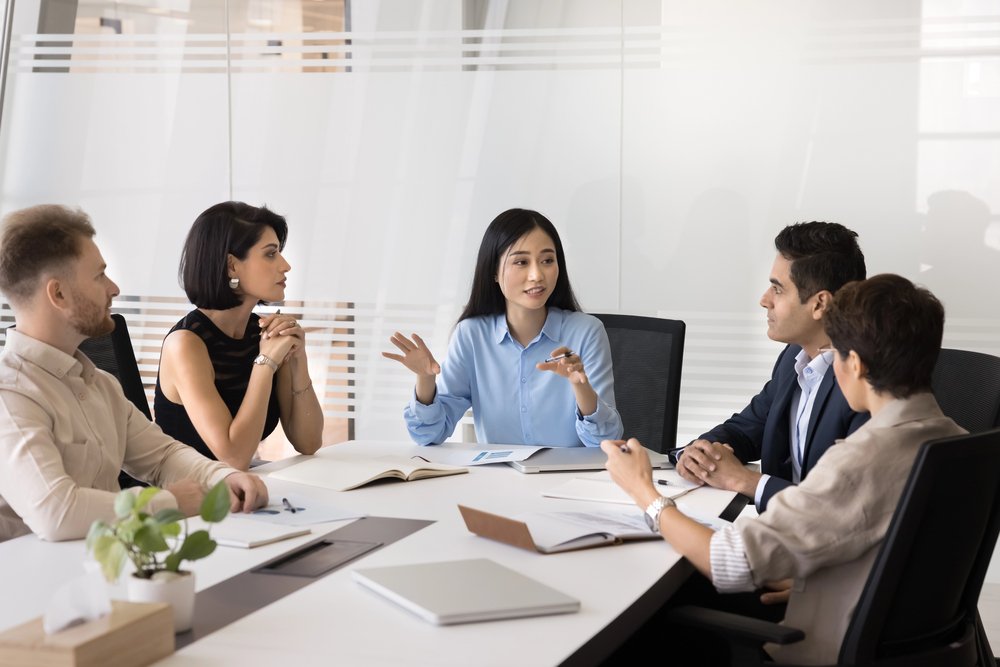 A woman speaking with other people